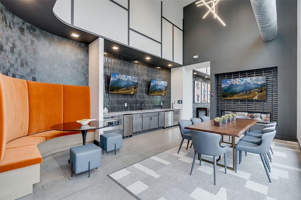 a dining room with a table and chairs