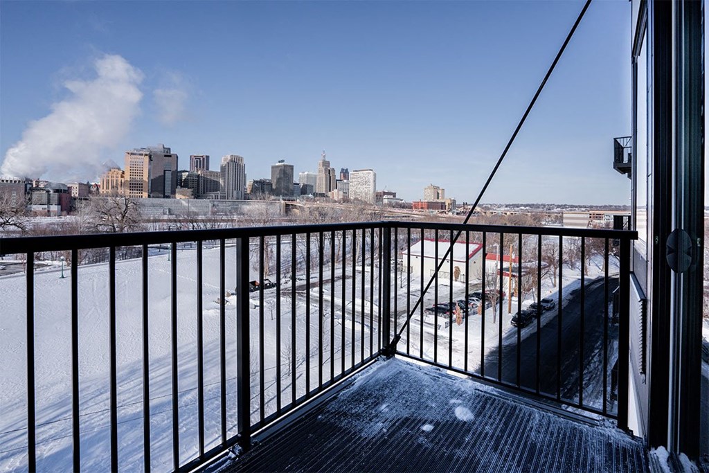 the view of the city from the balcony of a condo