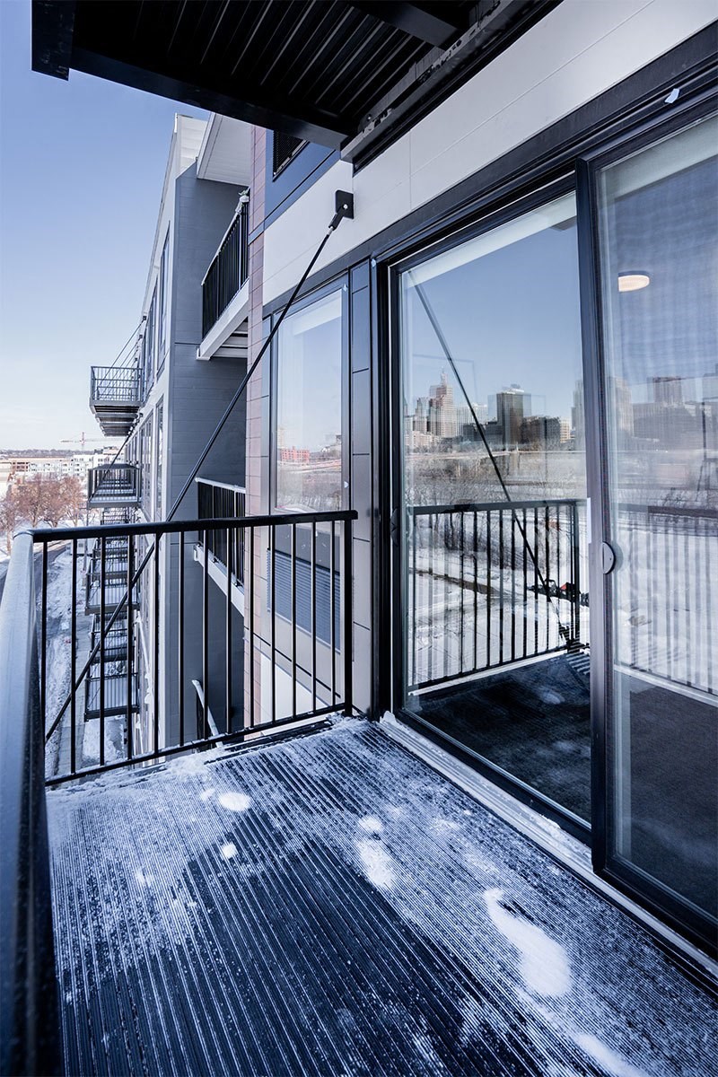 a view of the city from the balcony of a condo
