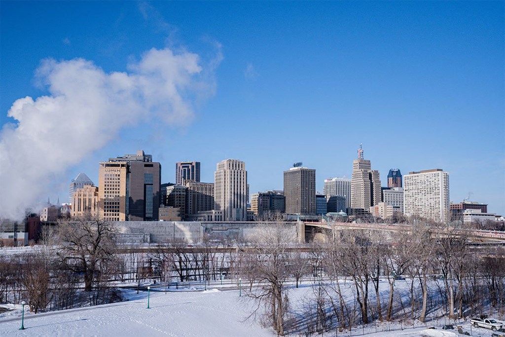 a view of the city skyline in the snow