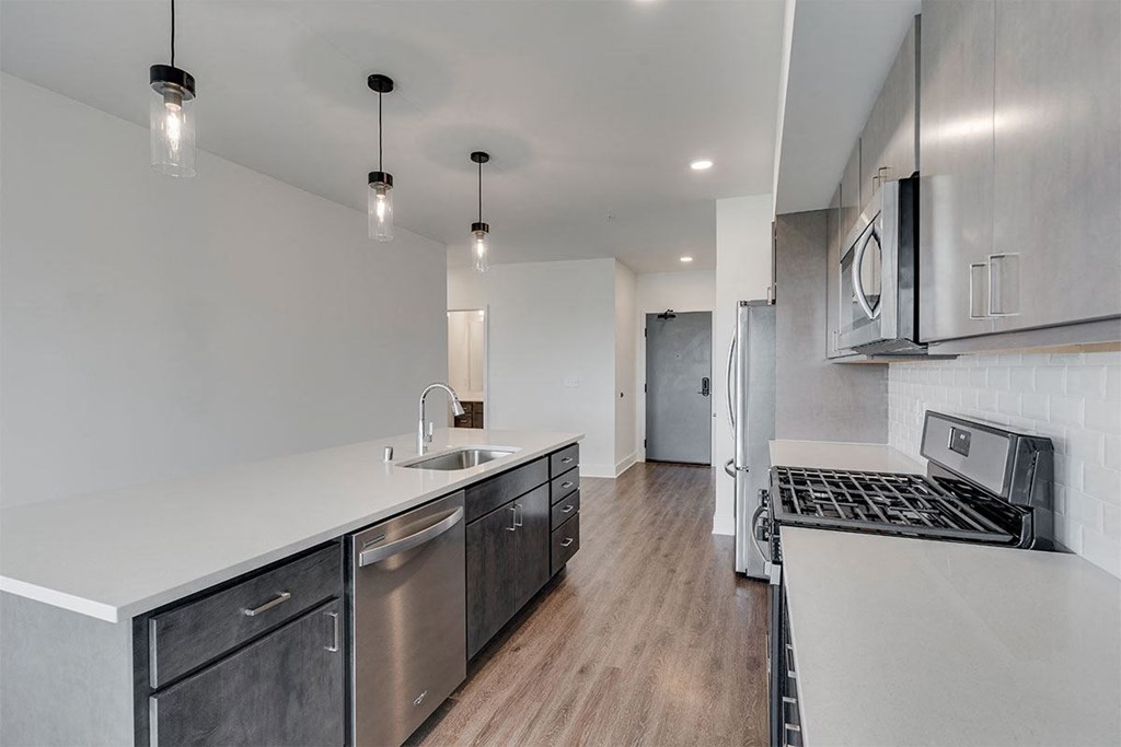 a kitchen with a stove and a sink