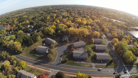 A suburban area with houses and trees.