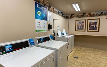 A laundromat with a sign that says "Do Laundry with the App".