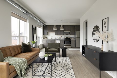a living room and kitchen in a 555 waverly unit