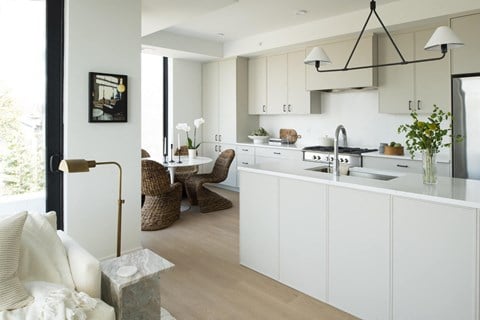 a kitchen and dining area in a 555 waverly unit