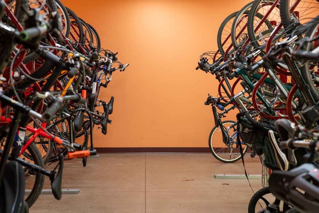 A bike rack full of bicycles.