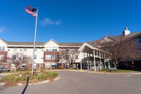 an flag flying in front of a building