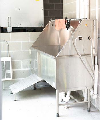 A large metal container with a hose attached to it.