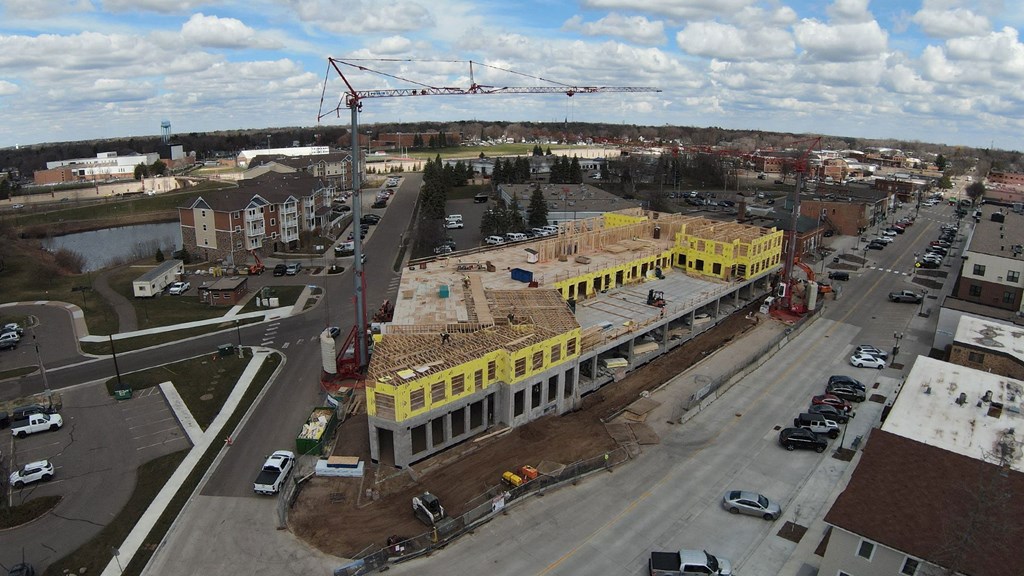 an aerial view of a building being constructed in a city