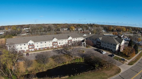 an aerial view of several buildings in a parking lot