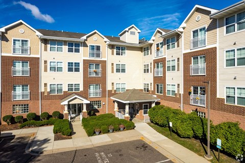 A large apartment complex with a courtyard in the middle.