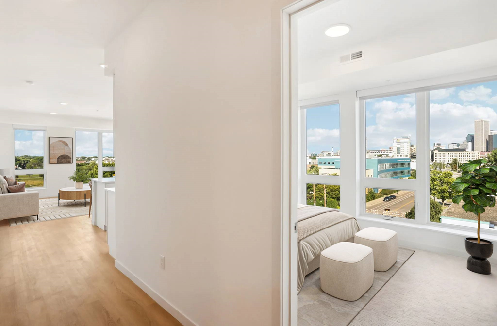 A living room with a view of the city.