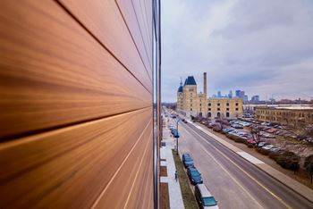 a view of the street from a building in a city