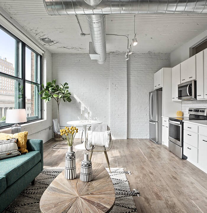 a small living room with a couch and a coffee table