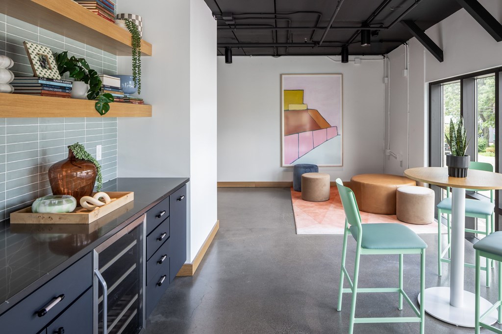 A kitchen with a cutting board on the counter.