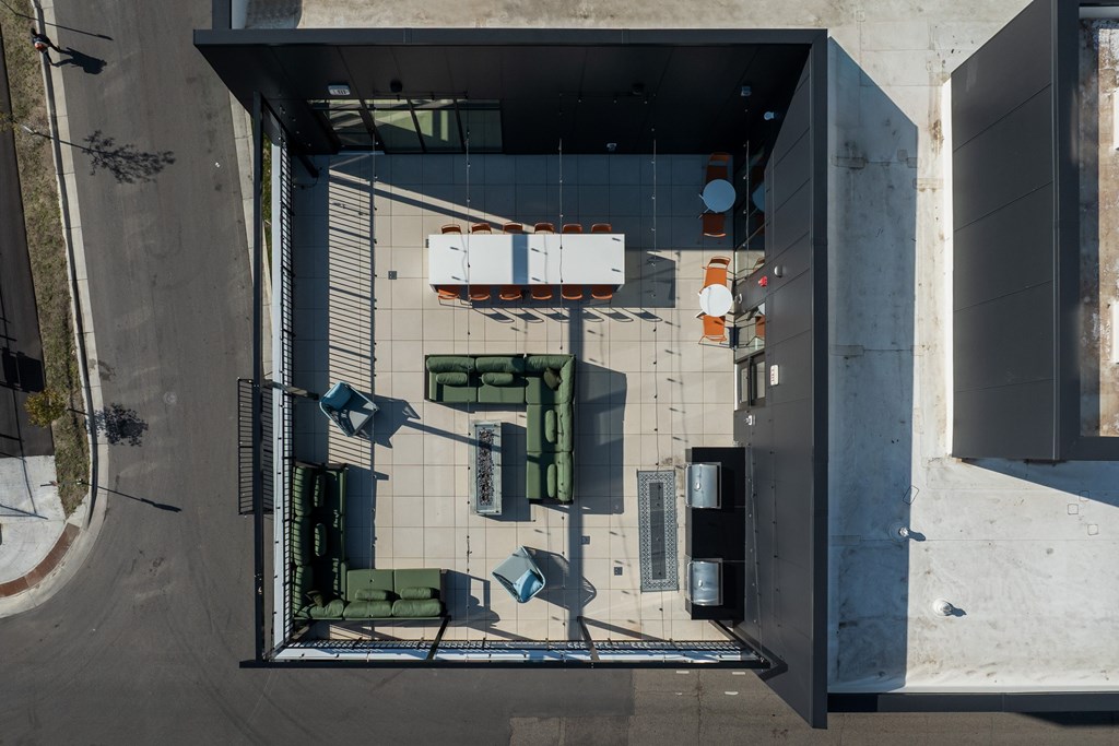 A top down view of a parking garage with cars parked.