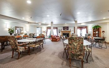 A large room with tables and chairs.