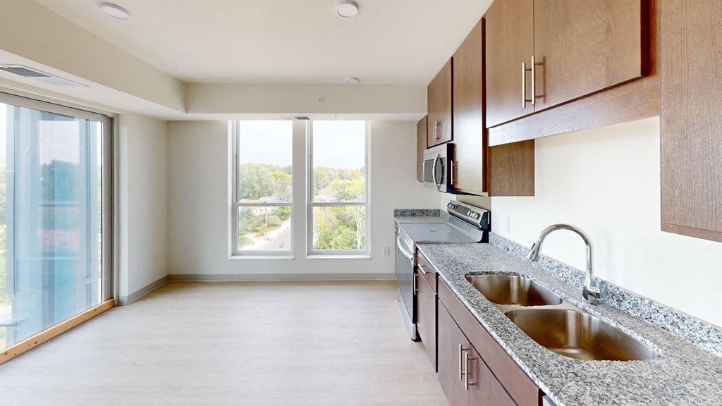 a kitchen with a sink and a window