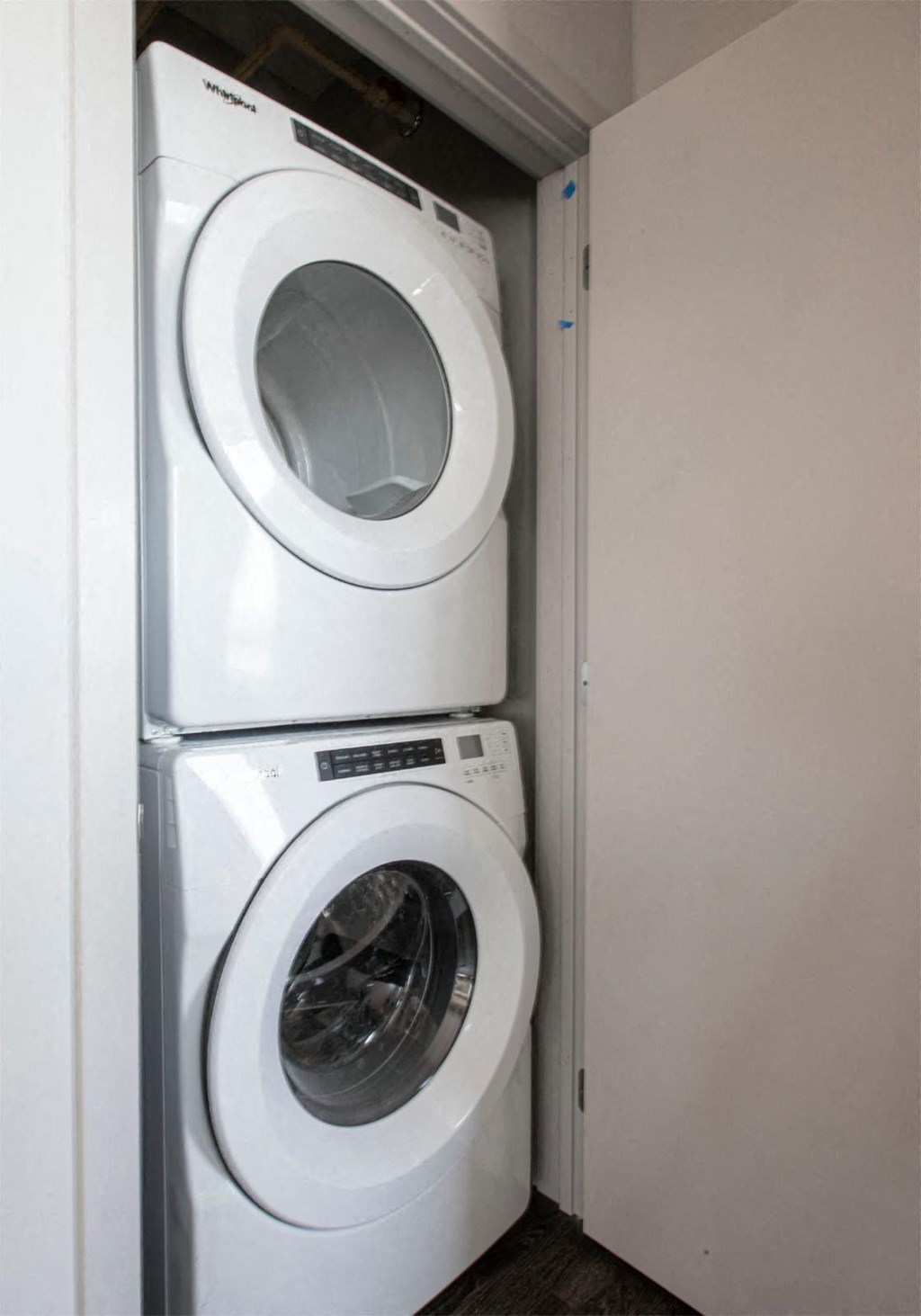 a washing machine and a dryer in a small closet