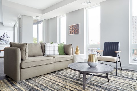 a living room with a couch and a table