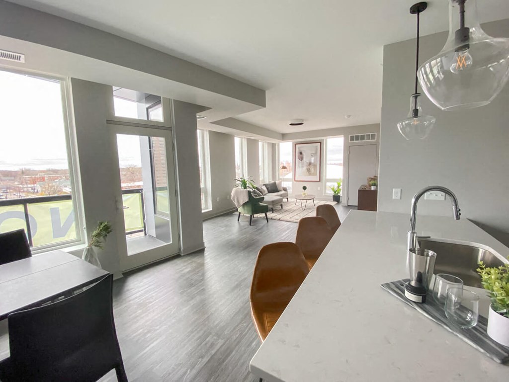 a kitchen and living room in an apartment