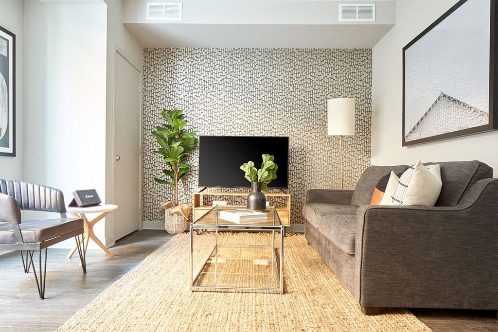 a living room with a couch and a table and a fireplace