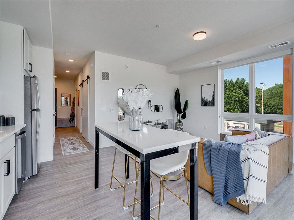 Open concept living room and kitchen lots of natural light