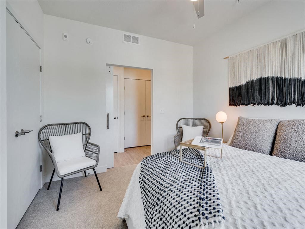 Bedroom with lots of room and two chairs