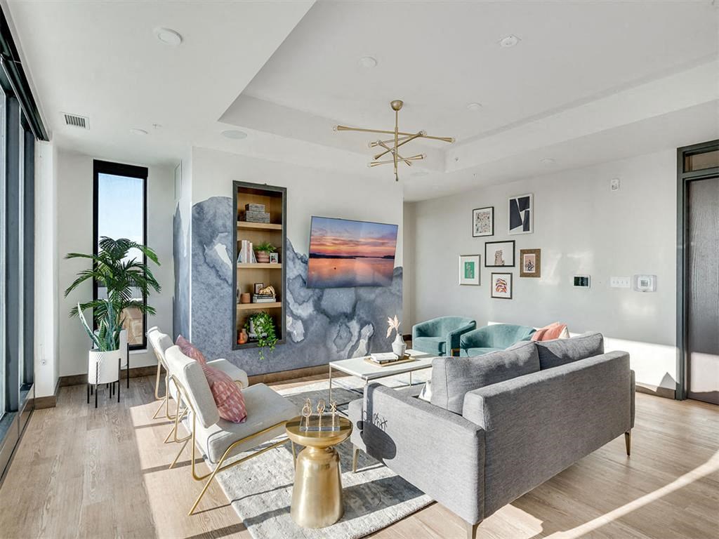 Living room with natural light and a couch
