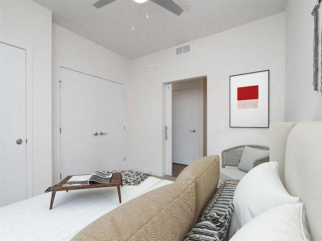 Bedroom with closet door and door leading to hallway