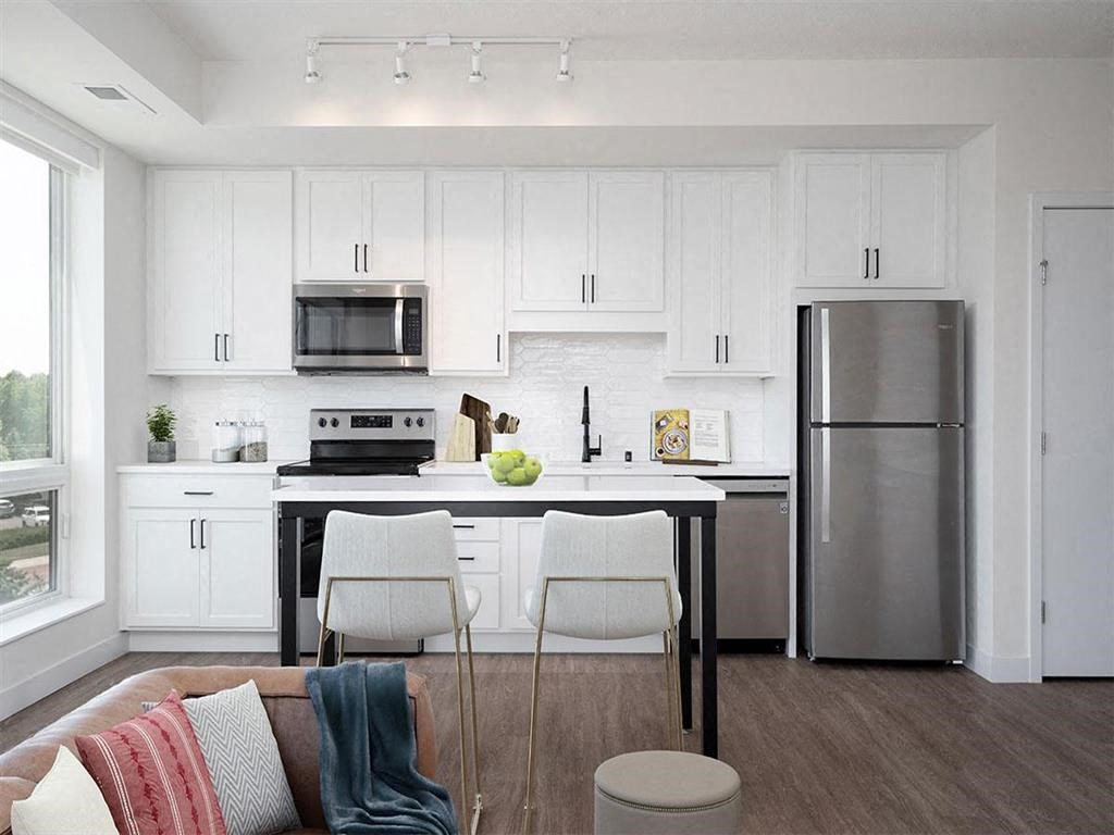 open concept kitchen with white cabinets