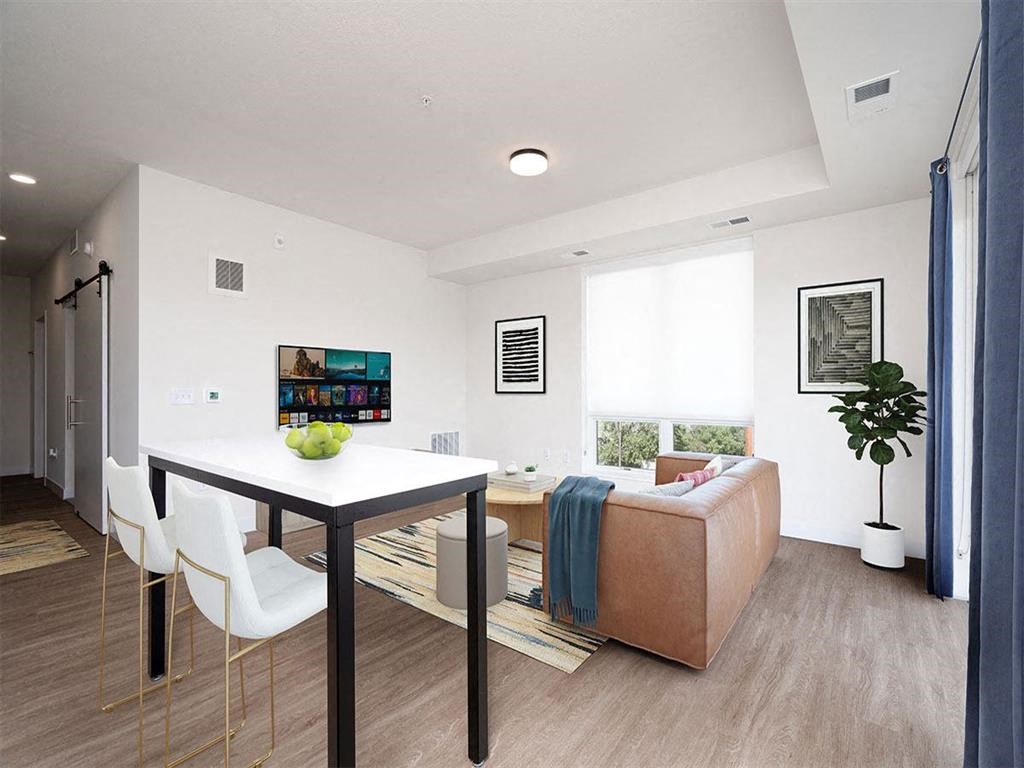 a living room with a table and a couch