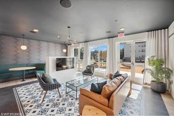 a living room with a couch and a table and a television