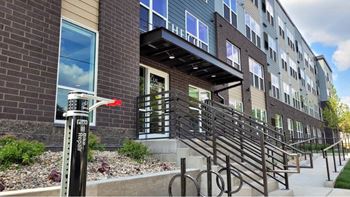 a bike parking meter in front of a building