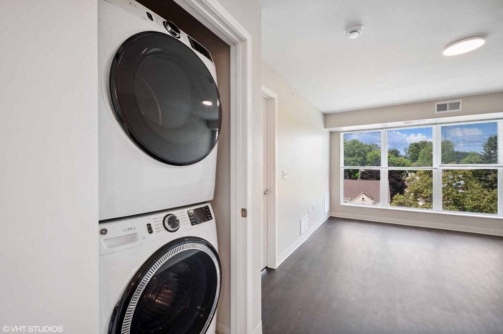 a washer and dryer in a room with a window