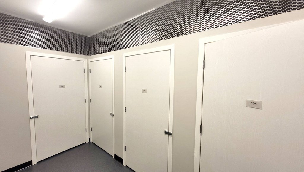 a row of white wardrobes in a room