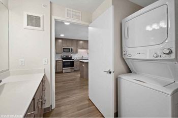 a white laundry room with a washer and dryer in it