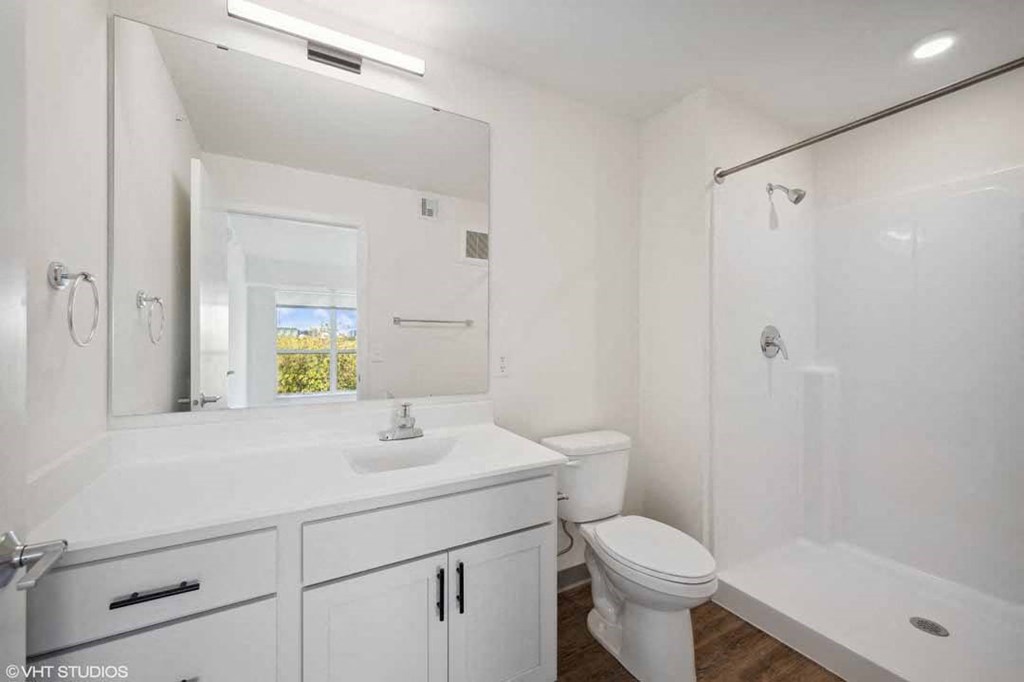 a bathroom with a sink toilet and a shower