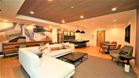 a living room with a white couch and a table