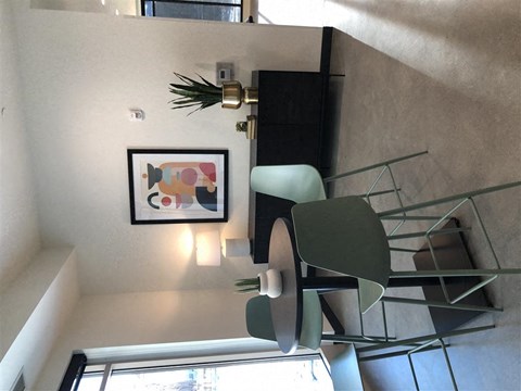 a dining room with a glass table and a chair