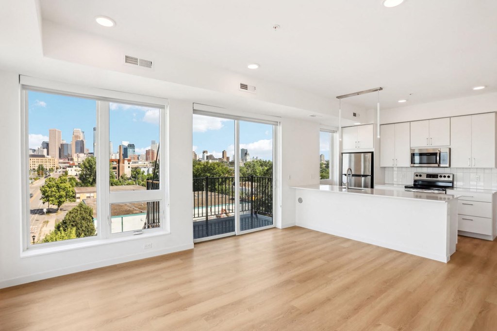 A modern kitchen with a view of the city.