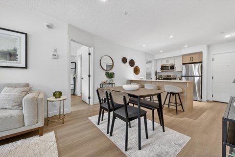 A modern living room with a bar area and a television.