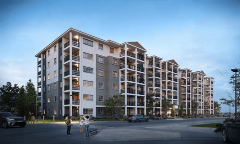 A modern apartment complex with multiple balconies and a few people standing outside.