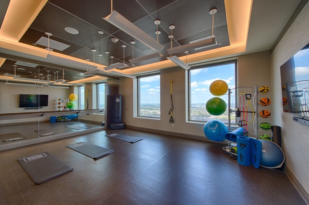 a yoga room with a view of downtown Houston
