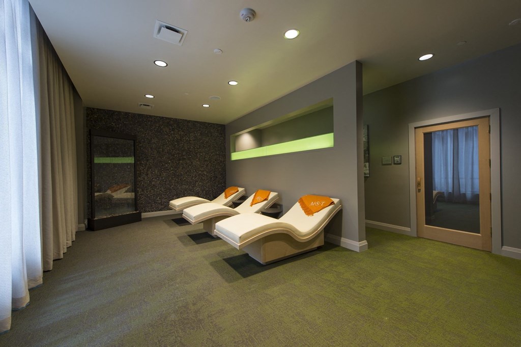 a room filled with furniture and a large window