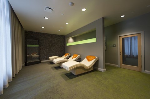 a room filled with furniture and a large window