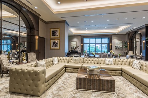a ballroom filled with furniture and a large window at Market Square Tower in downtown Houston