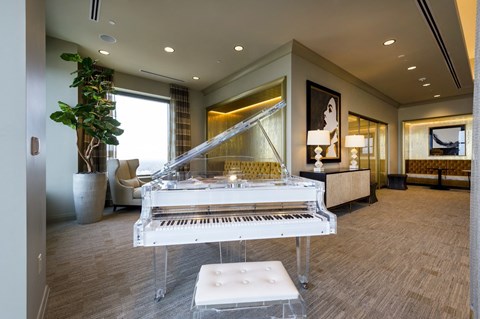 a white grand piano in the sky lounge on the rooftop of Market Square Tower in downtown Houston