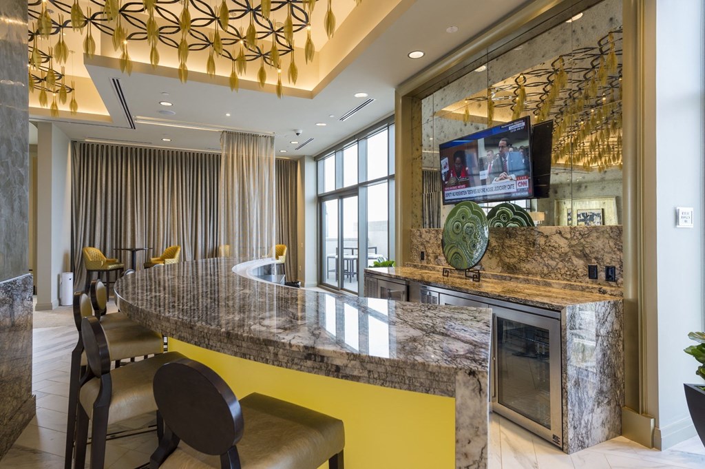 a bar counter with screen at the sky lounge on the rooftop of Market Square Tower in downtown Houston