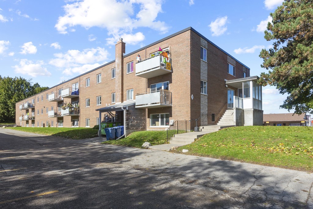 a large brick apartment building with balconies